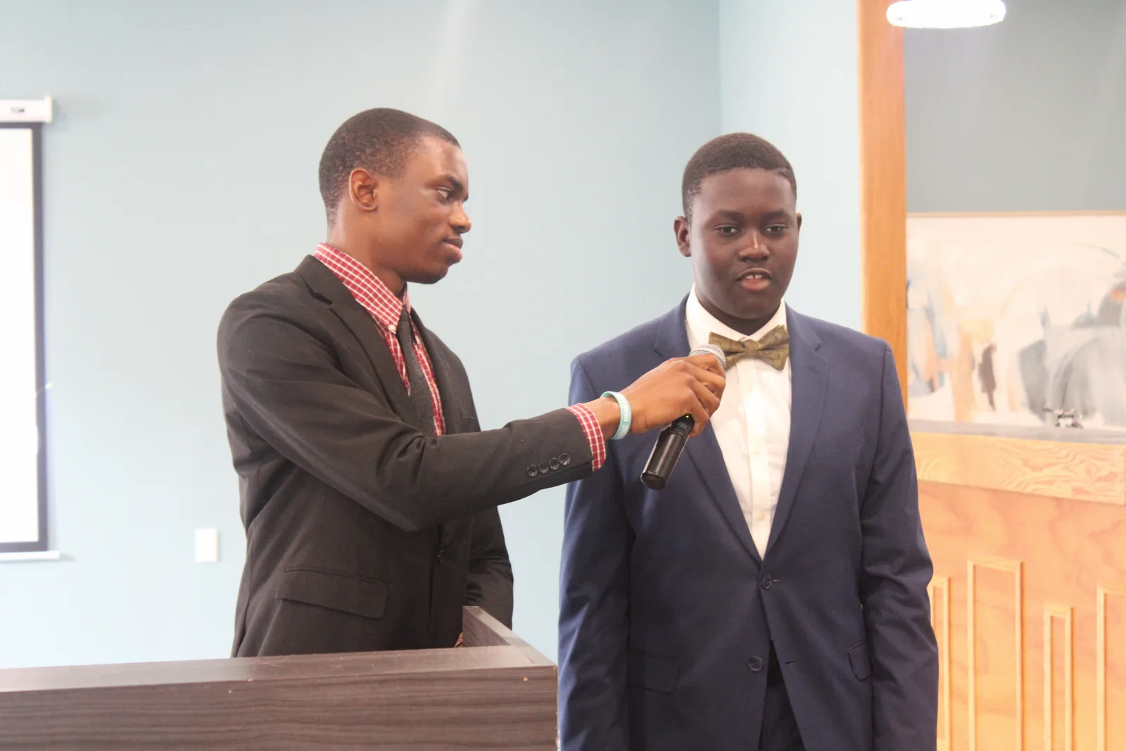 Two ministers at the podium during service