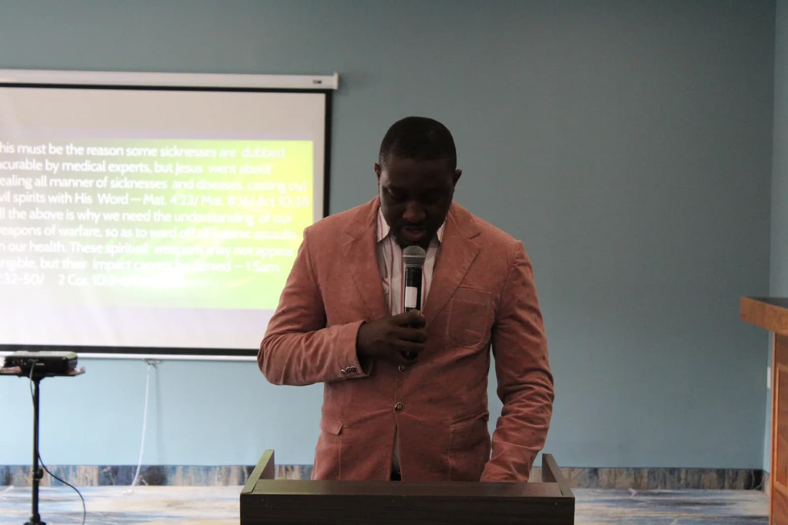 Pastor preaching during mid-week service