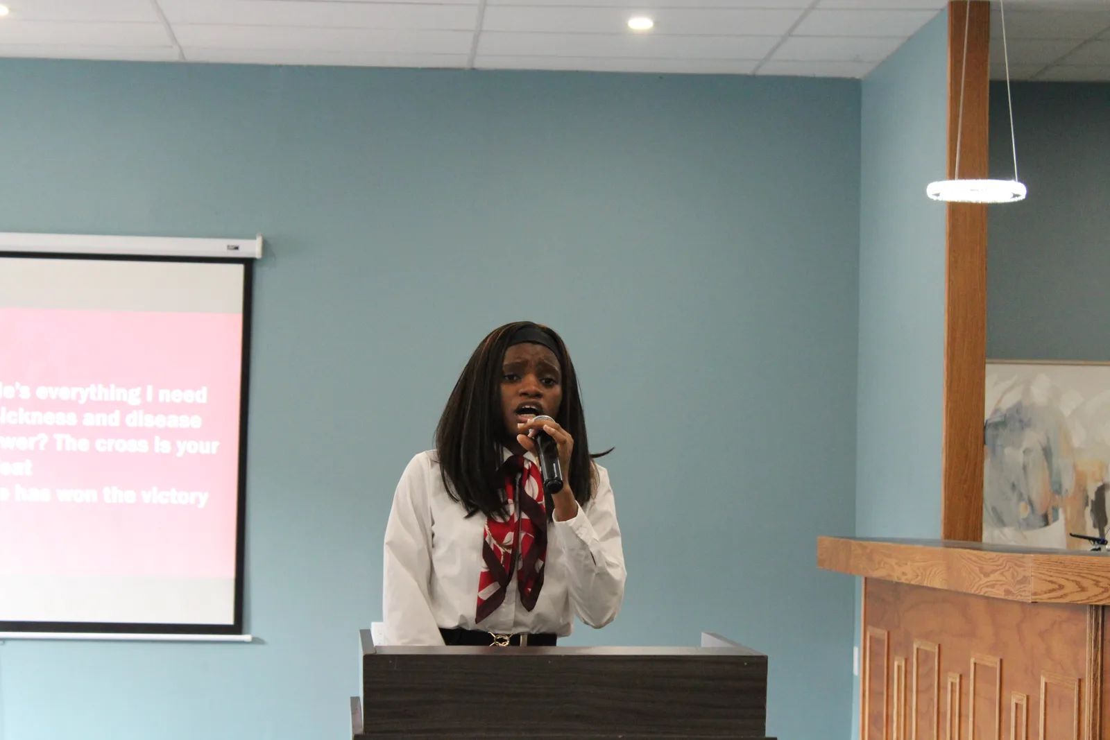 Speaker delivering a message at the podium